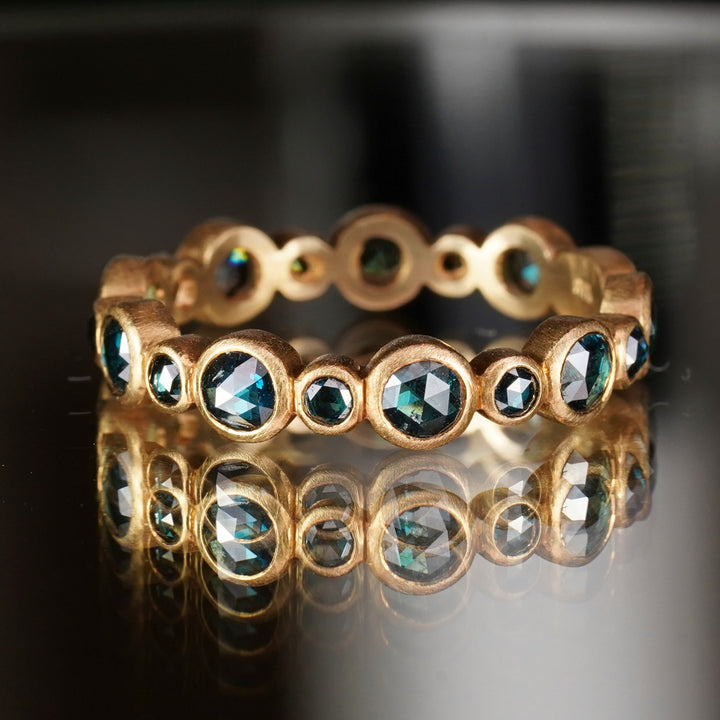 Blue diamond bezel set rose cut stacker ring.