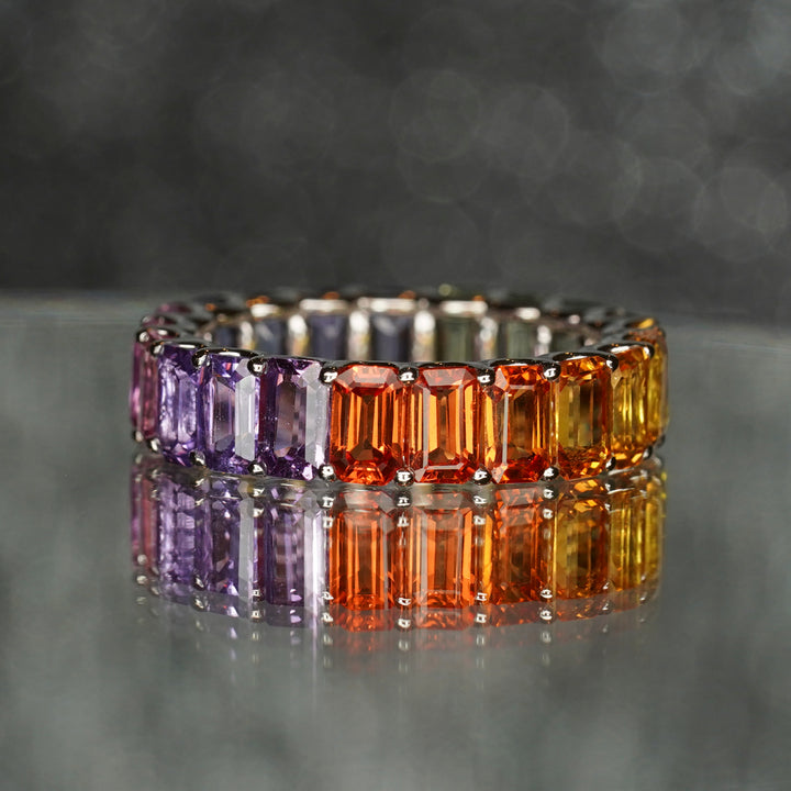 Emerald cut rainbow sapphire gold ring